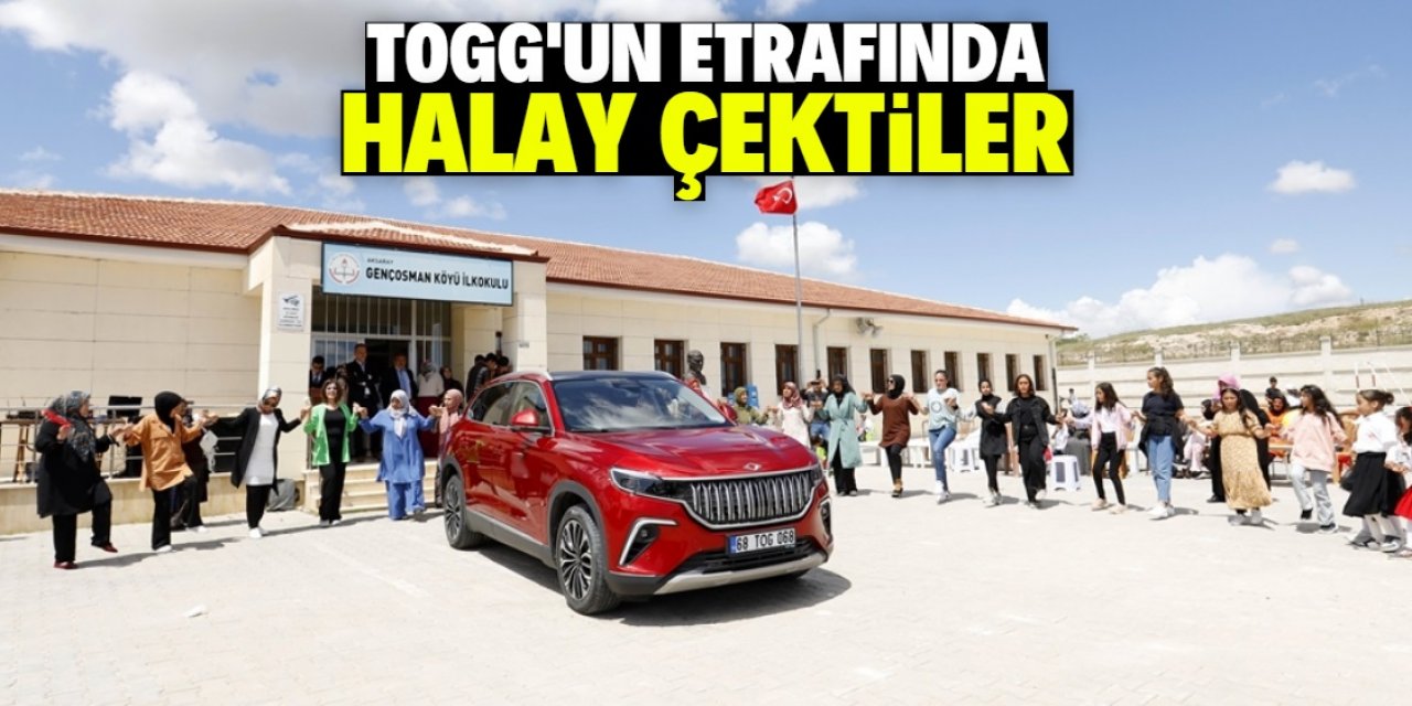 Togg'un etrafında halay çektiler