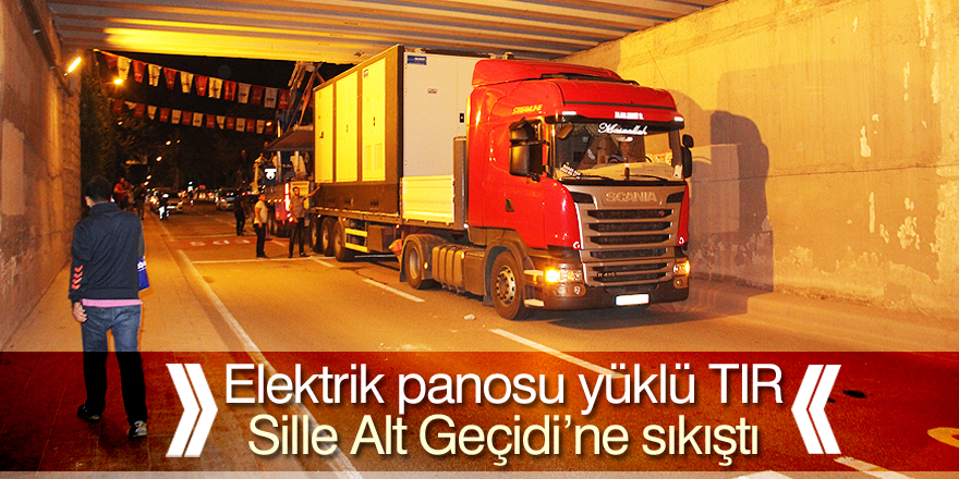 Alt geçide sıkışan tır çekici yardımıyla kurtarıldı