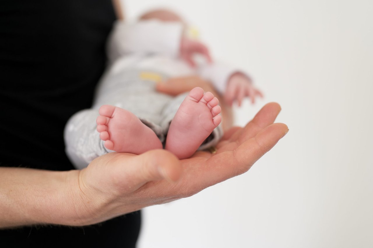 selective-focus-shot-person-carrying-newborn-baby-2048x1363.jpg